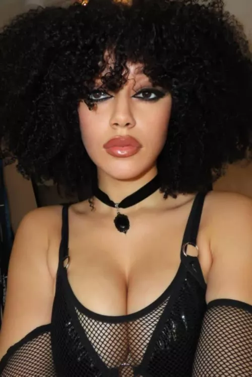 Dressed to impress in fishnet finesse.