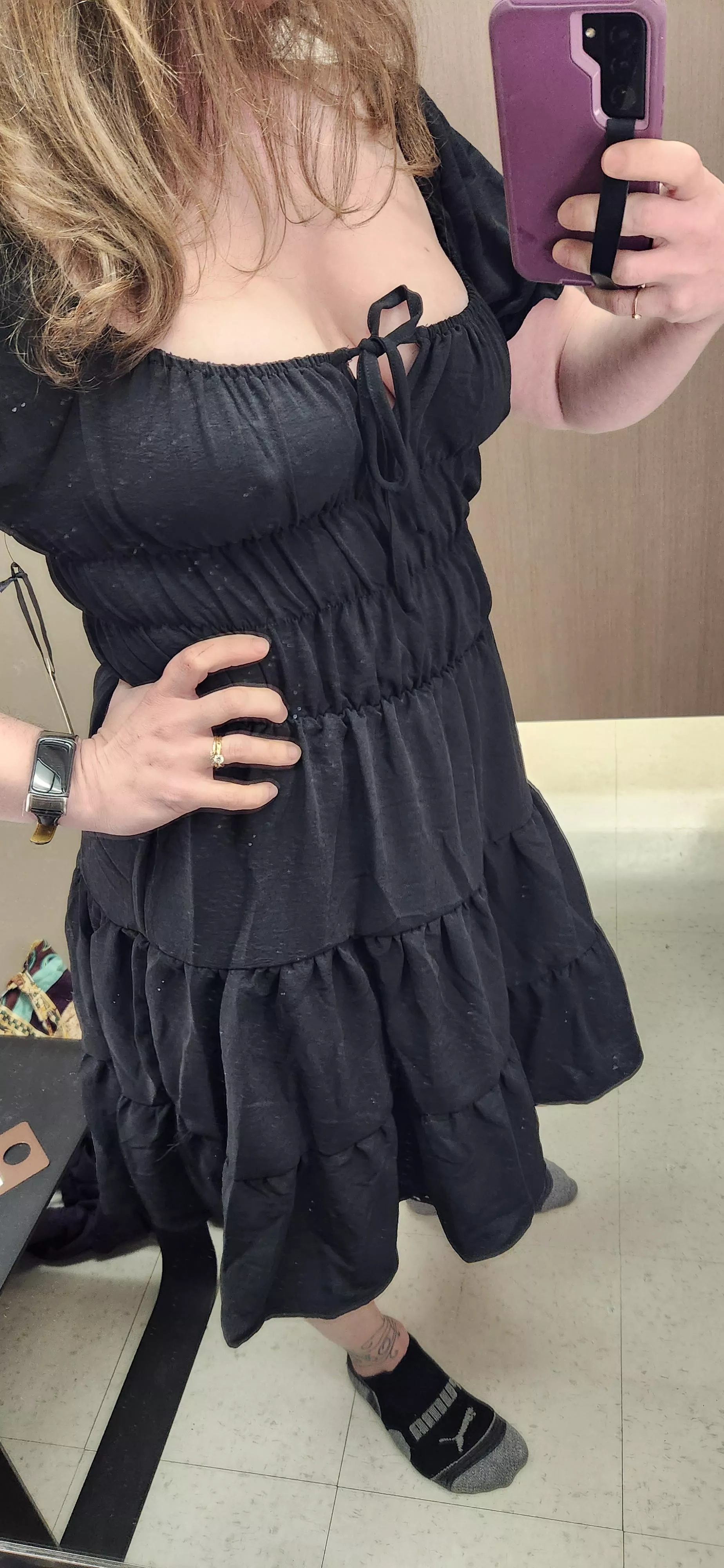 Trying on a cute black dress