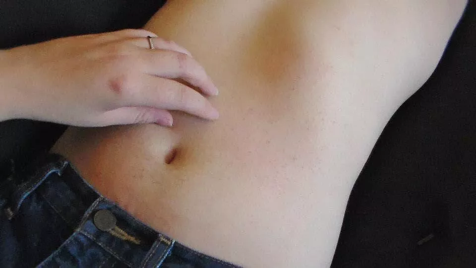 Brandi tickles J's navel