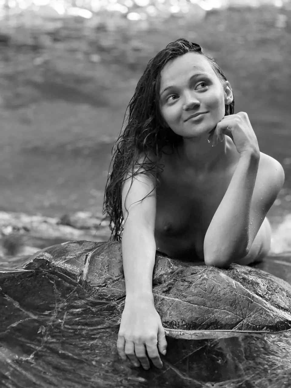 I'm only 20 years old. I'm lying completely naked on a big rock in nature. My baby boobs are beautiful in public, don't you agree?