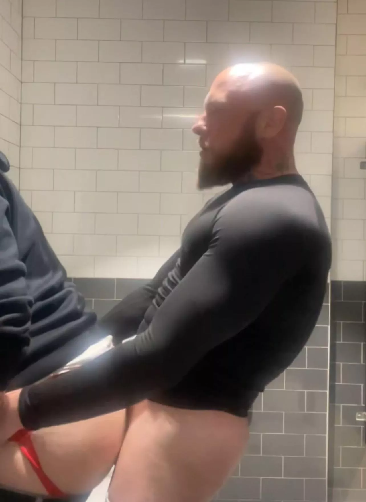 Loading him up in grocery store restroom 