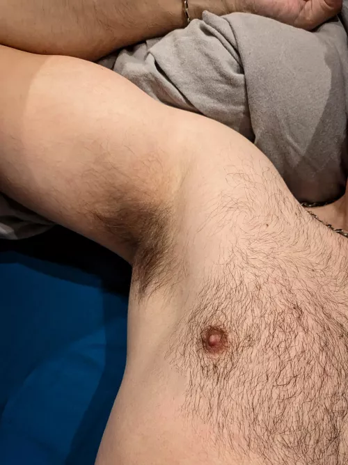 French guy laying in bed after working out