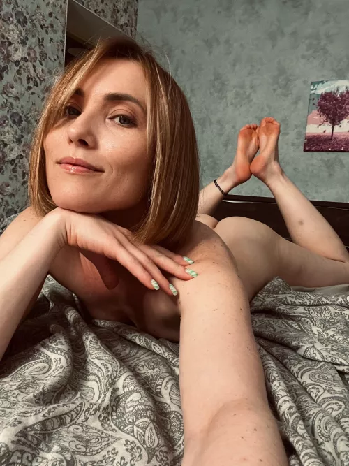 The ultimate relaxation, naked in bed.