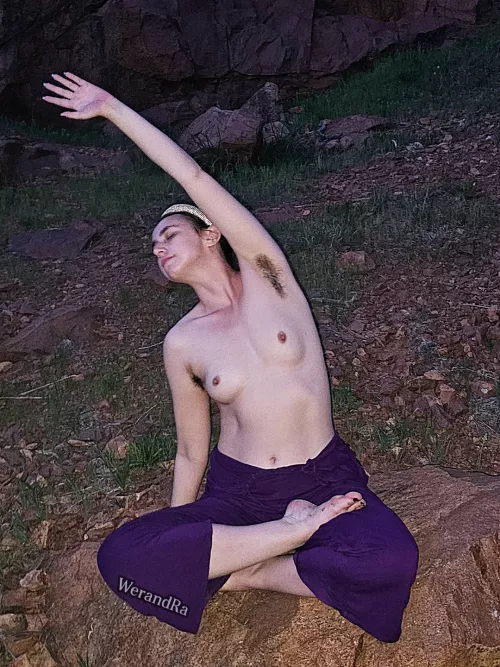 Topless stretching at night in nature