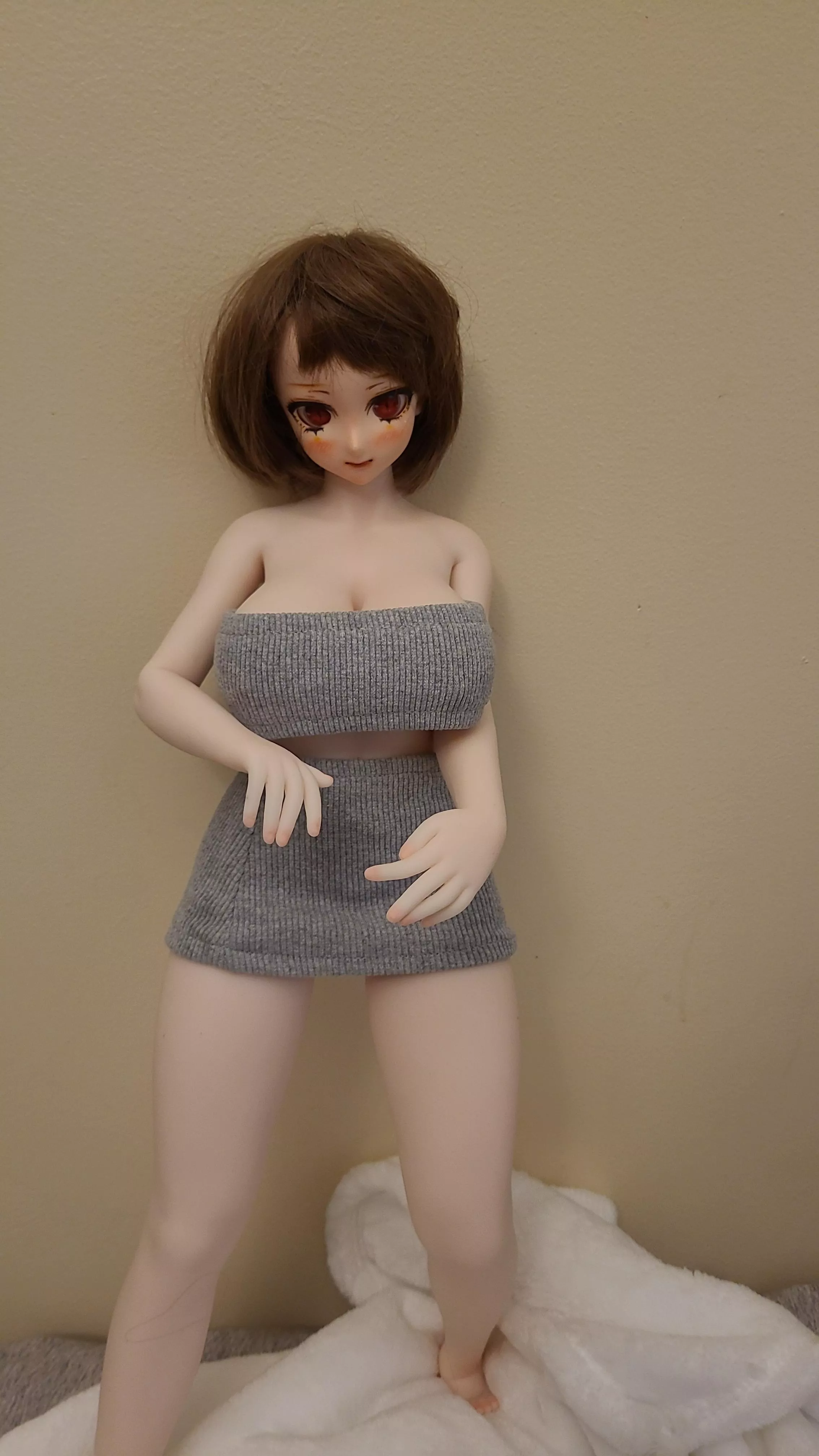 Hello, can someone tell me how to buy clothes for my doll? 