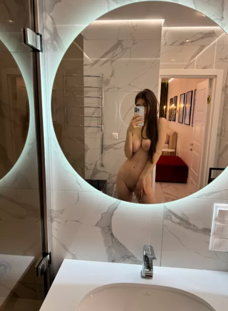 Large natural breasts look perfect in the mirror