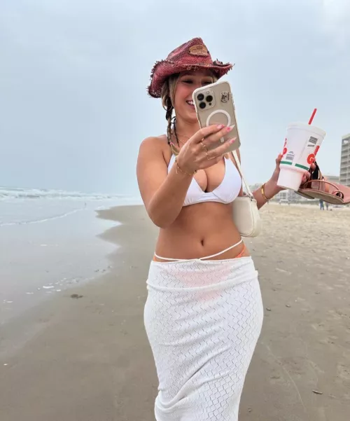 walking down the beach in a white kini and a diet dp