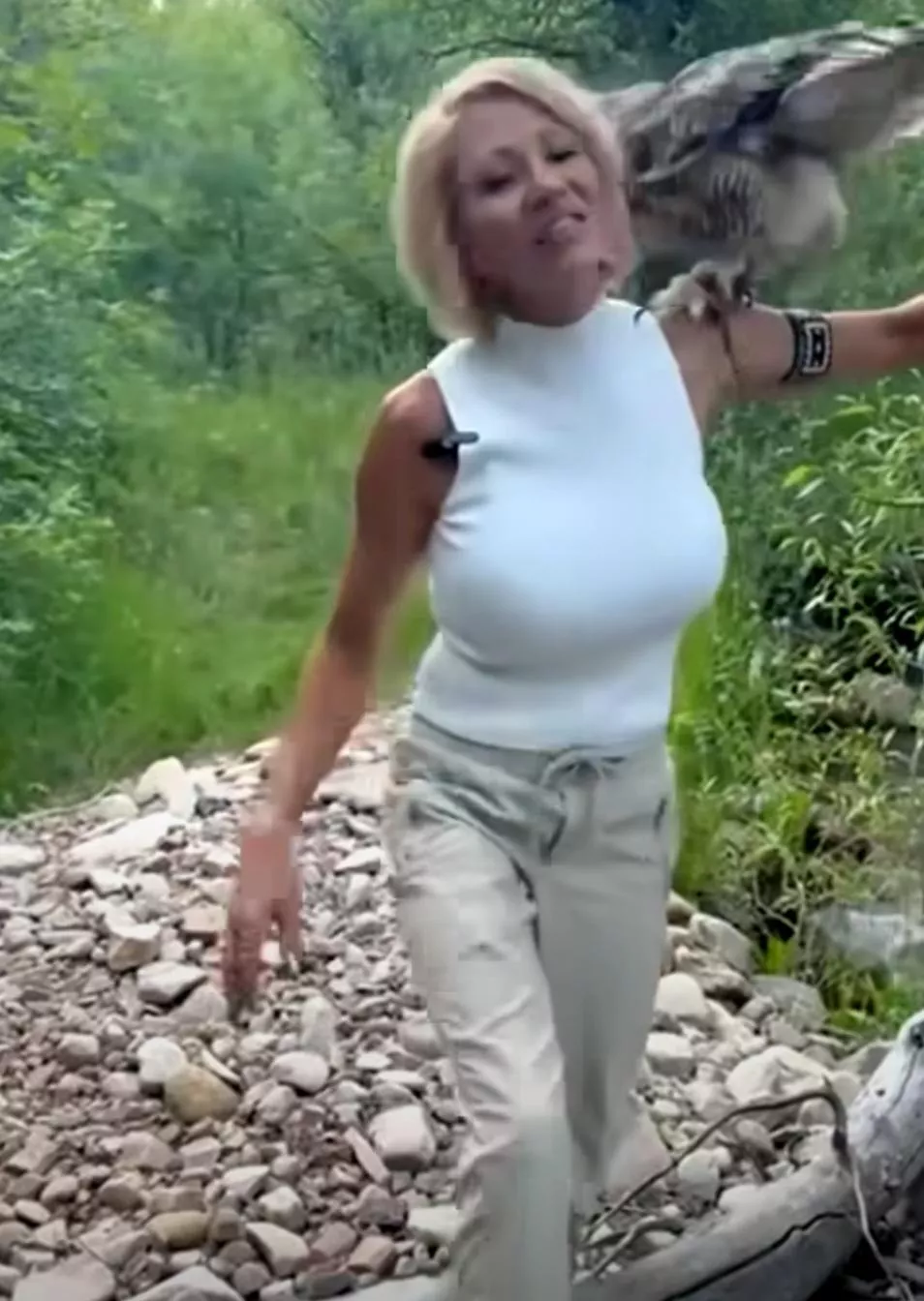 40ish milf walking her owl and hooters.