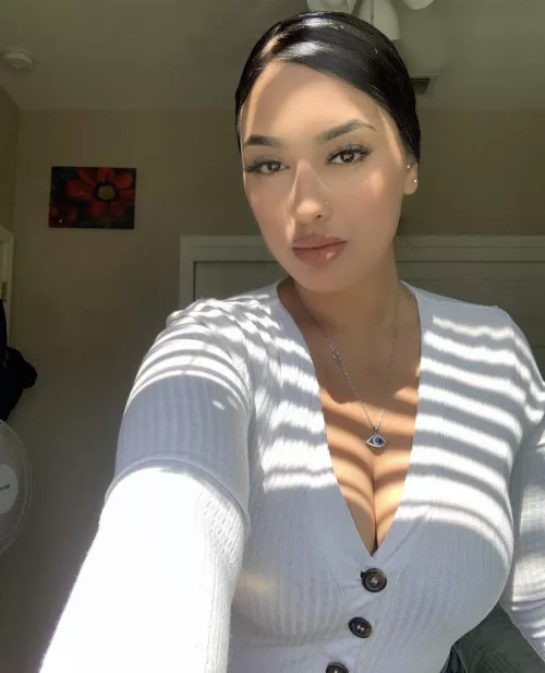 Doing her best to hide those puppies