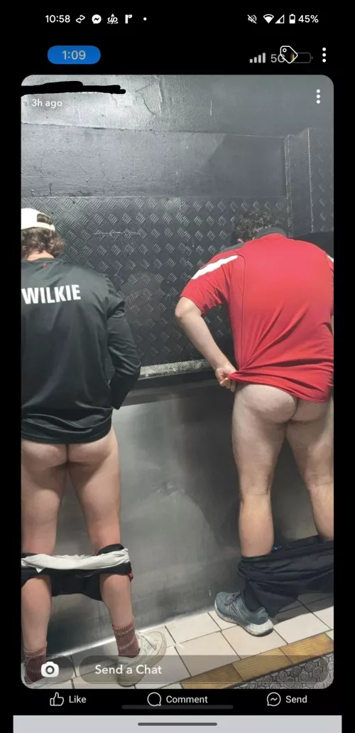 Fellas pissing together