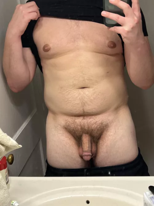 Took this in the bathroom at my friend’s house. Do you like a beefy bro with a hung soft cock?