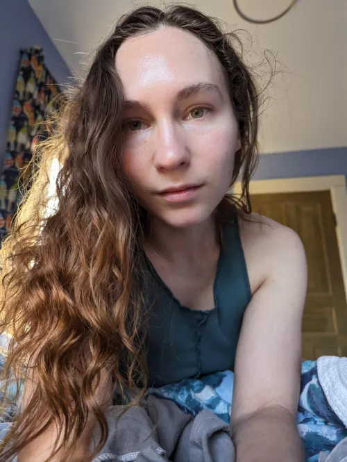 The sunlight highlights my brunette hair