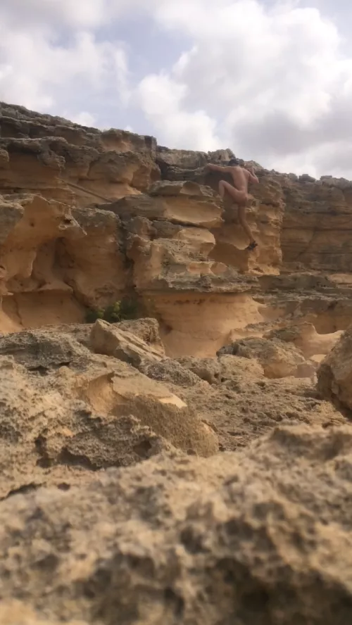 Climbing at nudist beach, mallorca near puig de ros