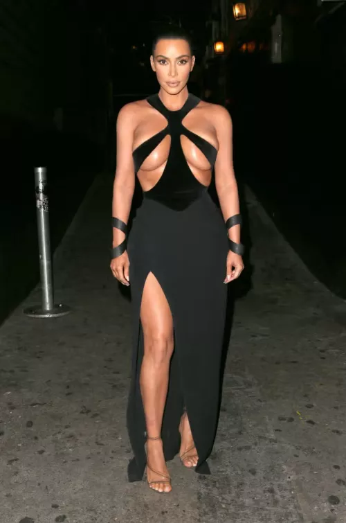 Kim about to bust out of her dress