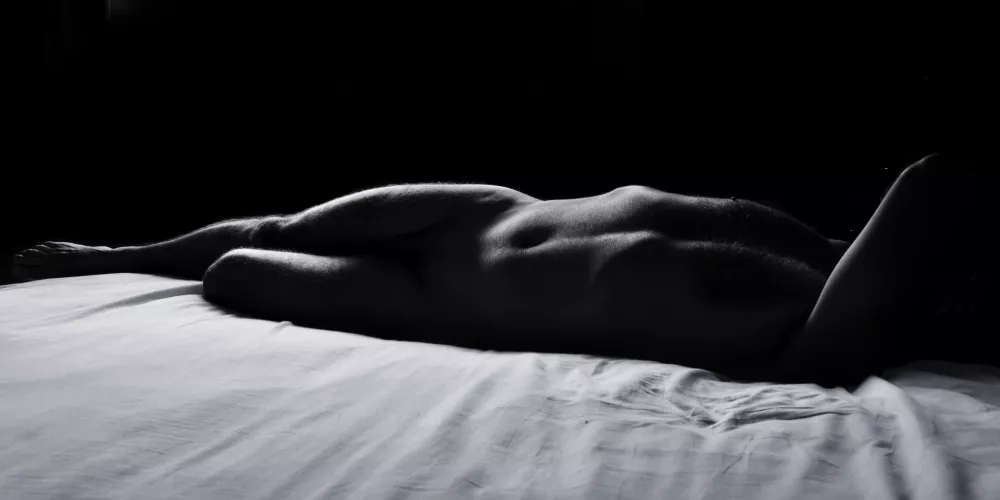 male nude on bed