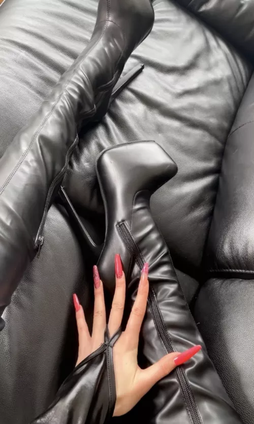 Leather boots on a leather couch