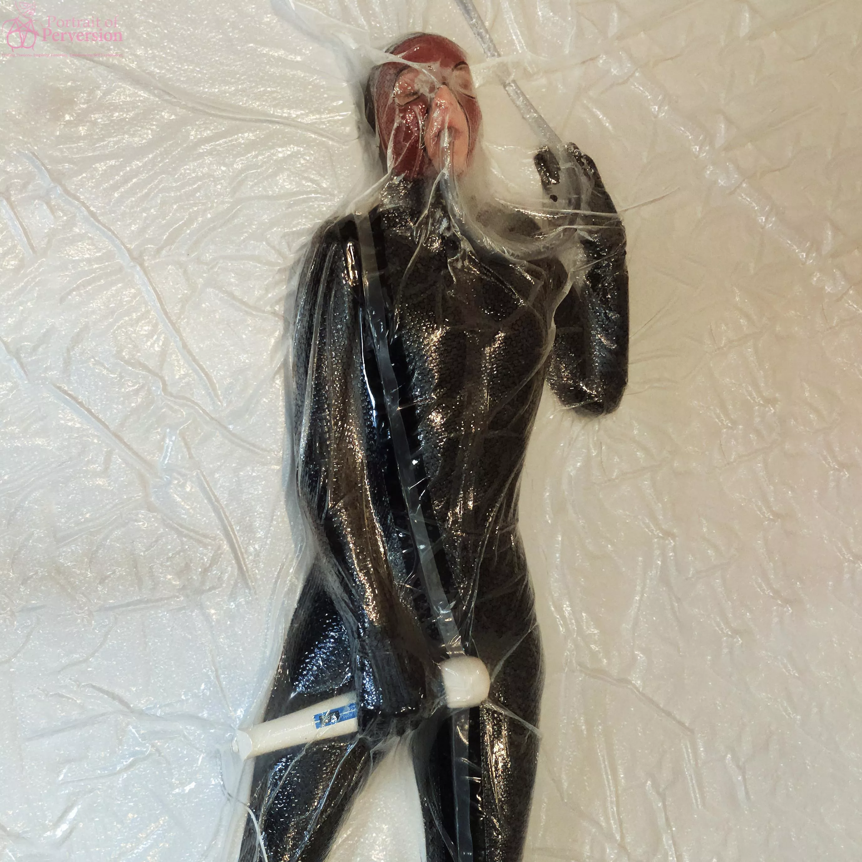 Dollified: A Vacuum-Sealed Rubber Toy Getting Itself Off With A Magic Wand