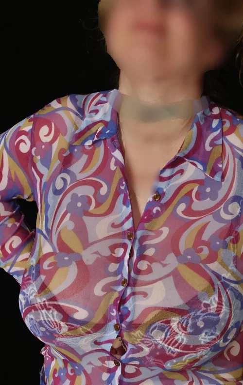 Busty Blond BBW MILF is putting with her Big Tits a lot of pressure on the buttons of the tight transparent blouse