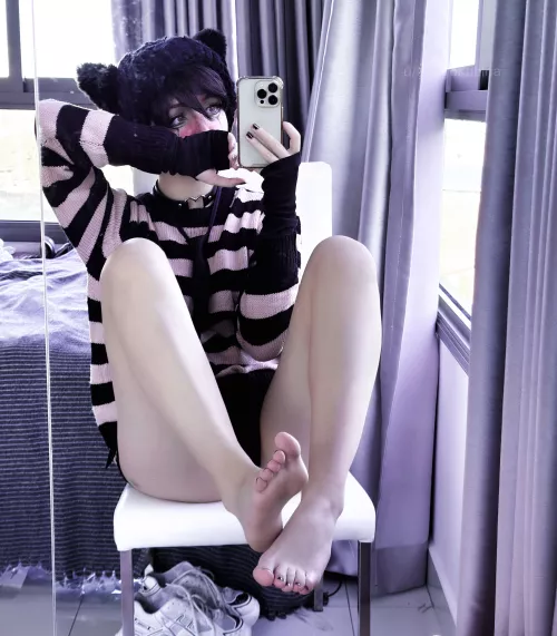 emo tomboy hiding behind her feet