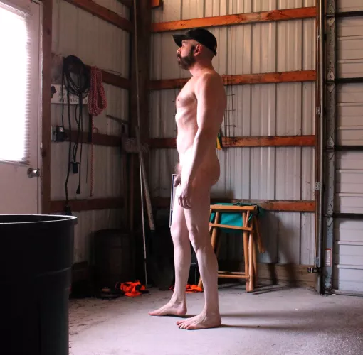 (54) In the pole barn - too hot in there for clothes.