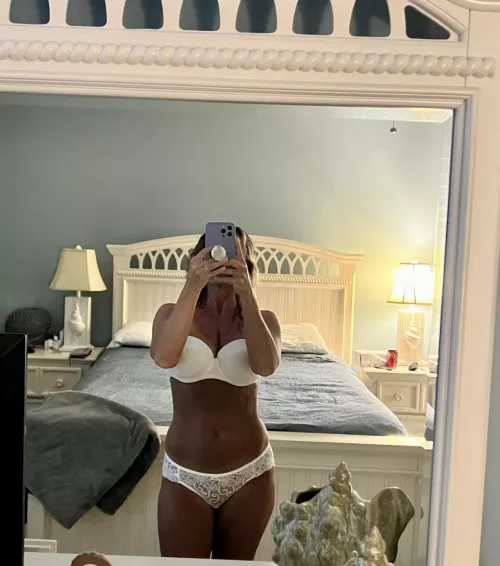 Liking the tan against the white panties and bra?