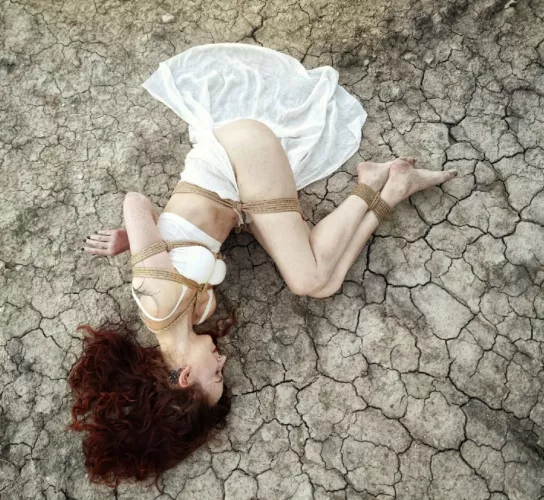 Needing help identifying tie around her waist and thighs please! Thanks