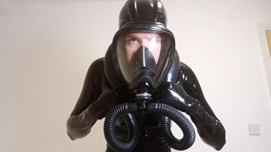 Hooded gas mask makes full enclosure easier