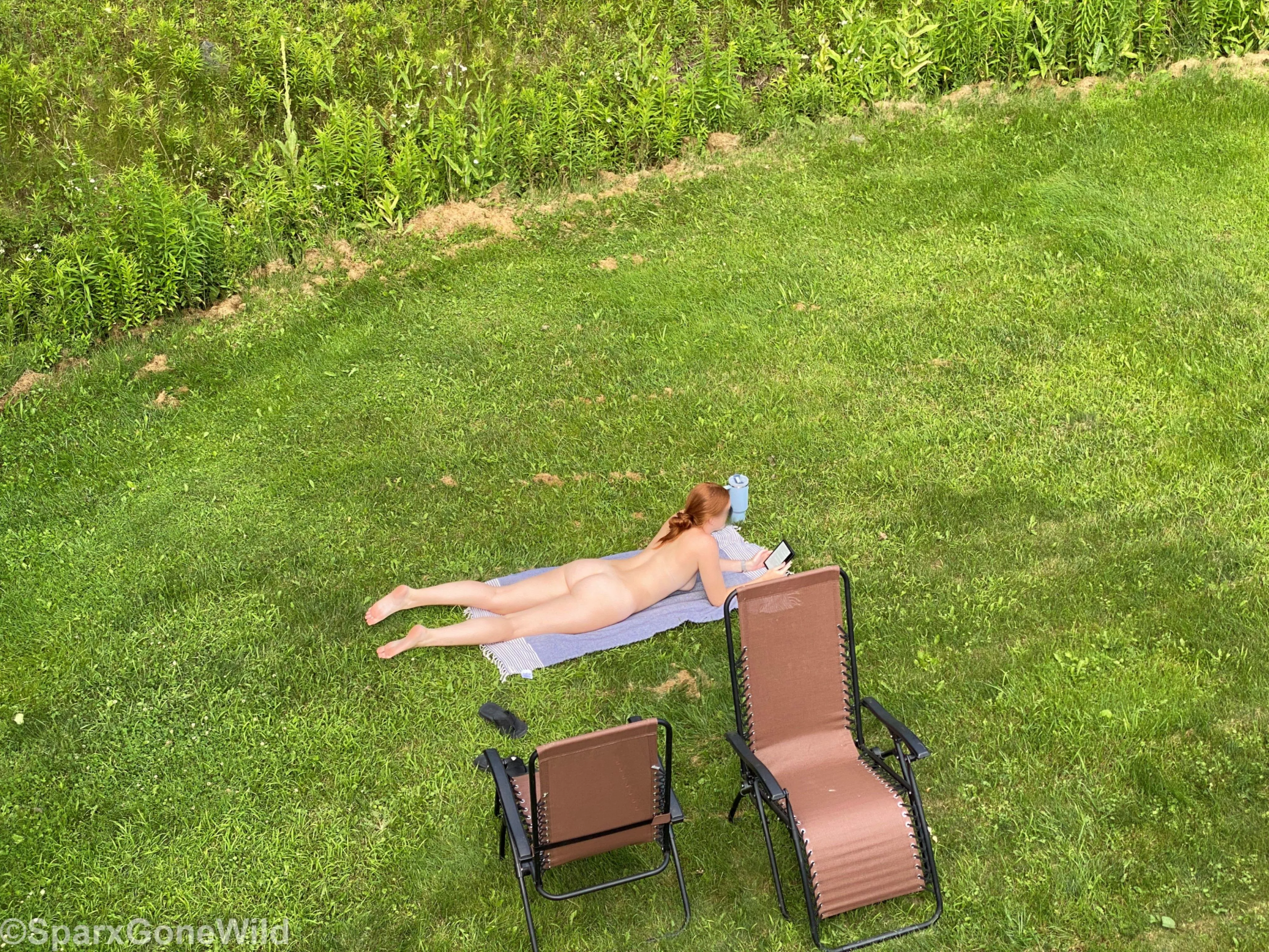 Tanning in a park for everyone to see