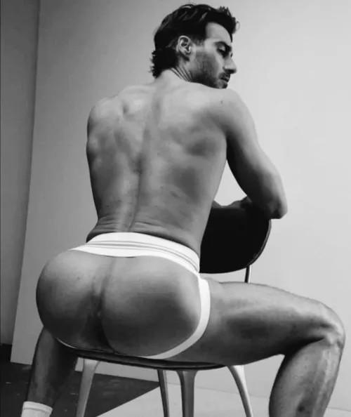 Seated in jockstrap 