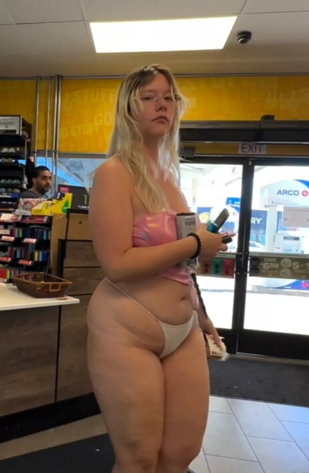 Girl in a bikini at a gas station 