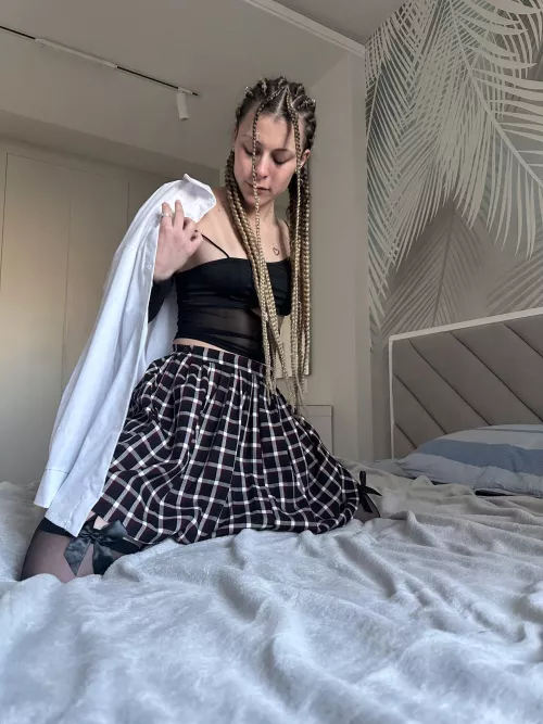 Plaid skirt, tight shirt.