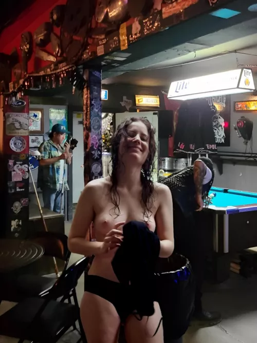 Topless at the metal bar