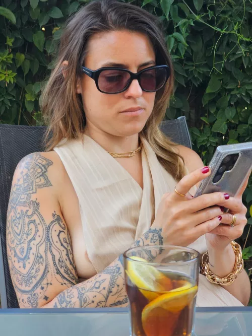 Unaware that my boob was about to pop out of the side of my dress. Rather than tell me, my husband took this photo