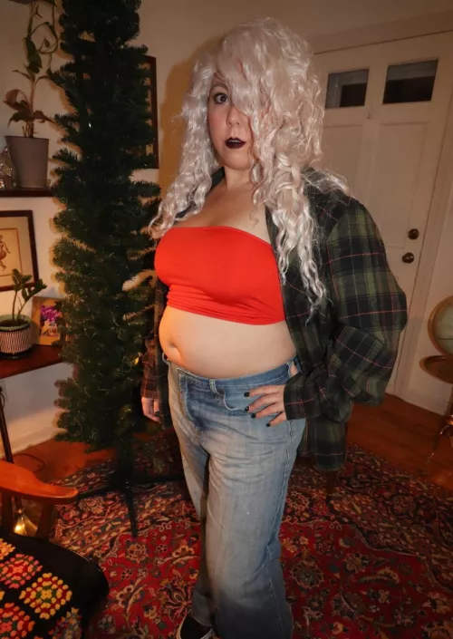 Showing off that belly in a tube top