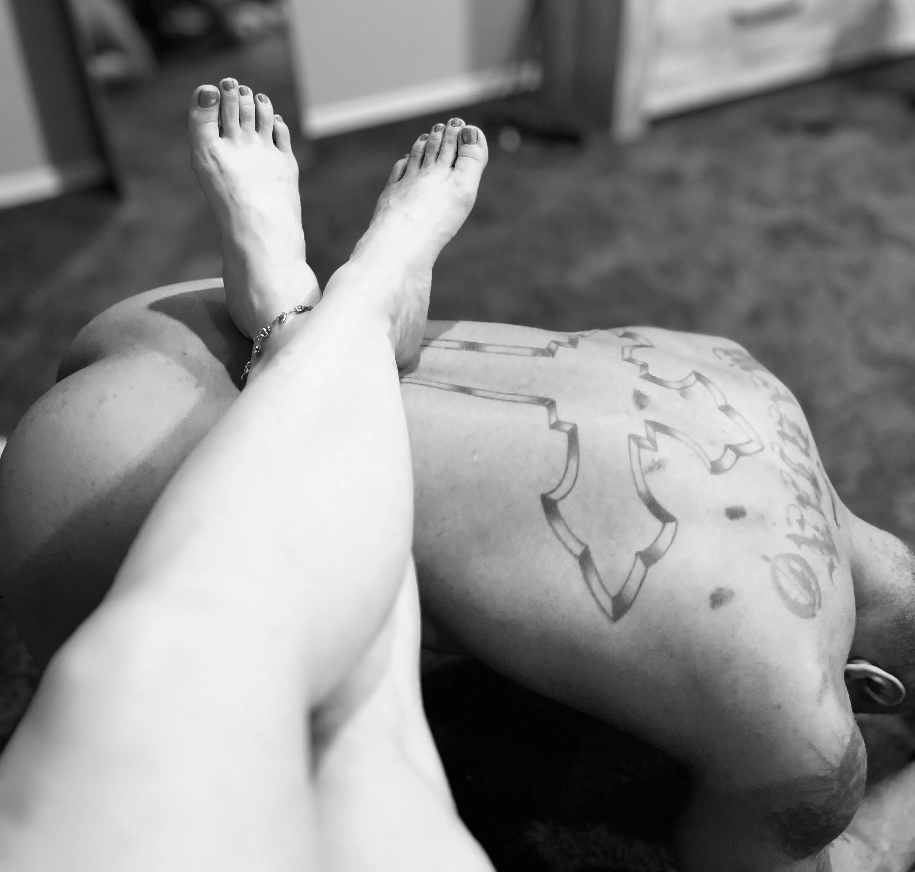 Kneeling as a footstool as my Master chats on FaceTime