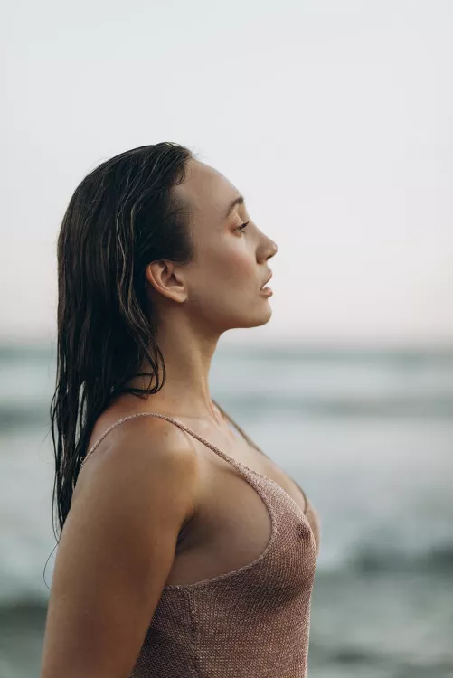Seductive sideboob with a Mediterranean Sea view