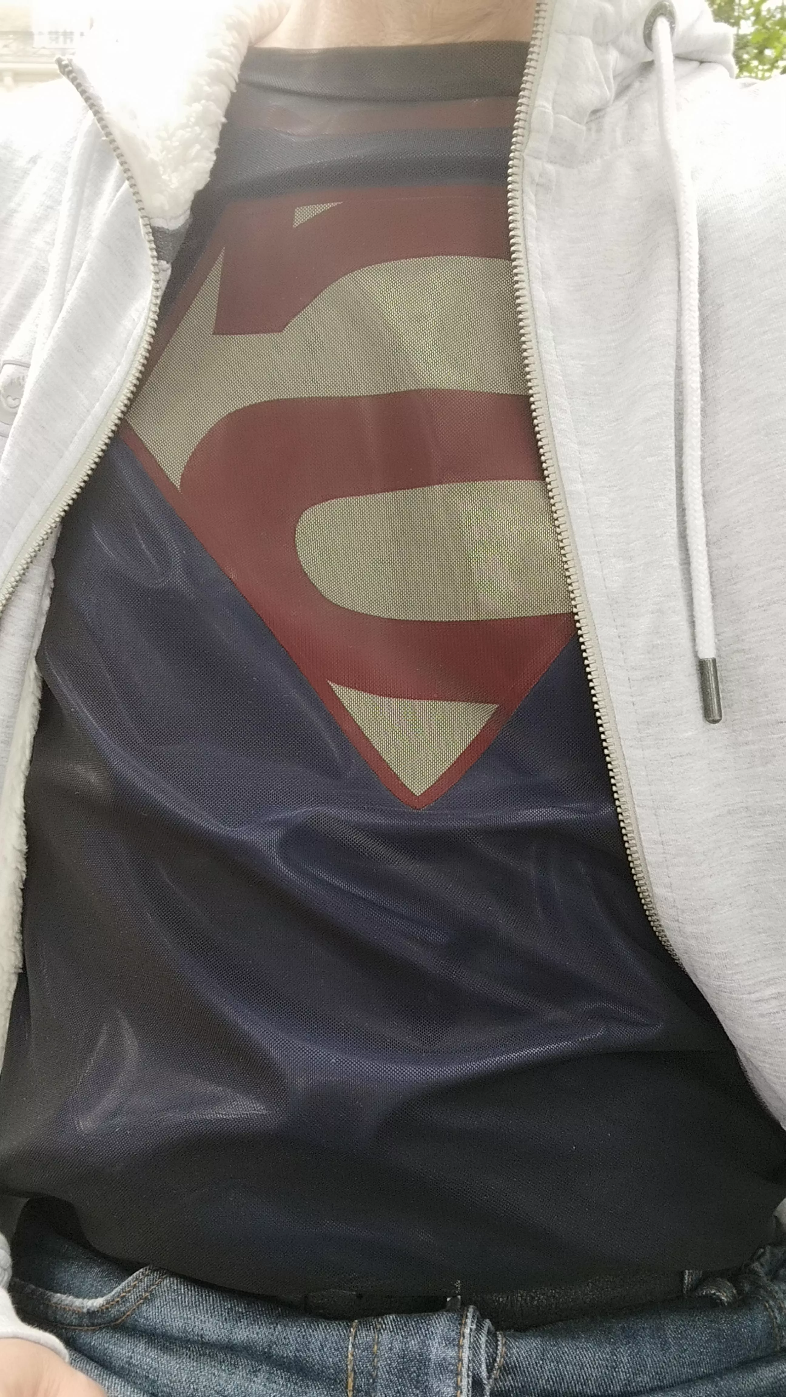 Out and about in my latex superman t-shirt 