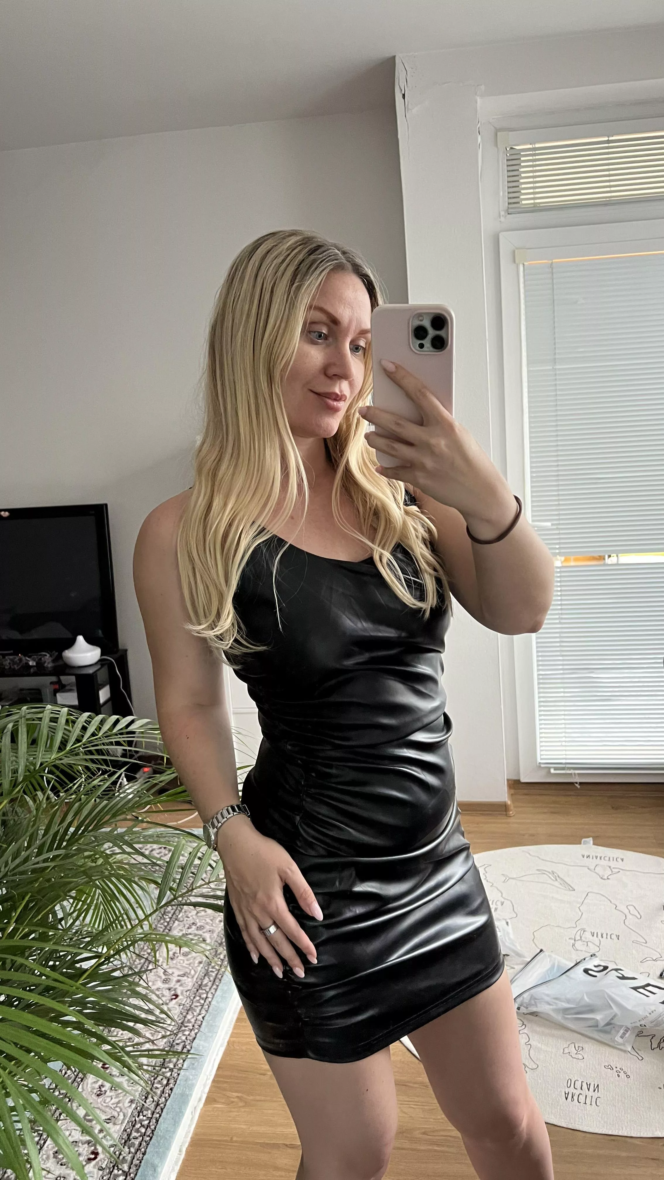 Blonde in a leather dress: dare to be bold