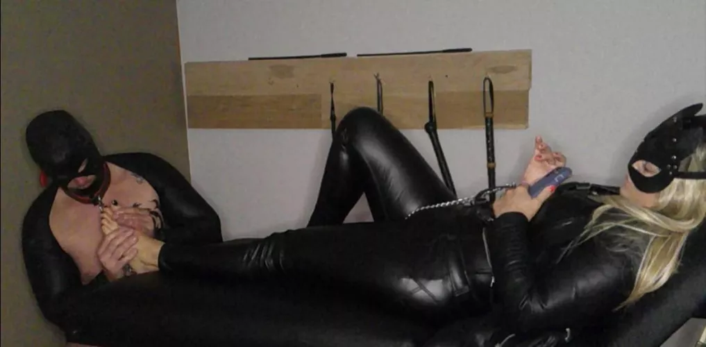 This is how we end every night!  Him locked and leaking dreaming of my feet!