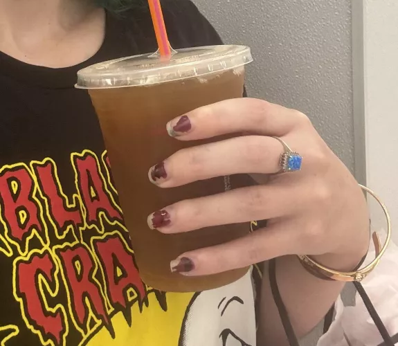 Hand holding a coffee