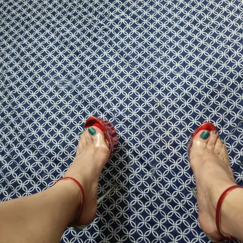 Red high heels and blue nails