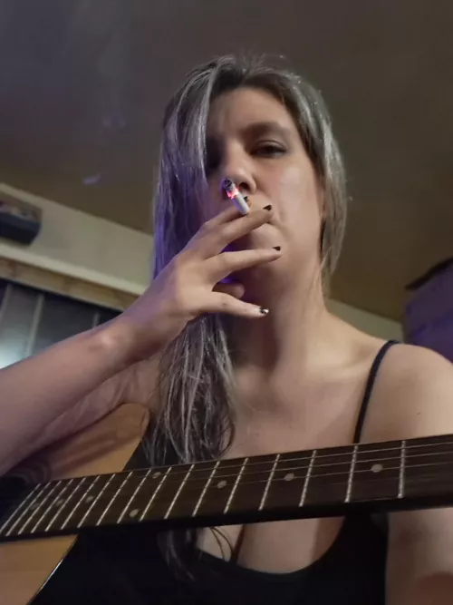 Yes, I play guitar (and I sing too!)...