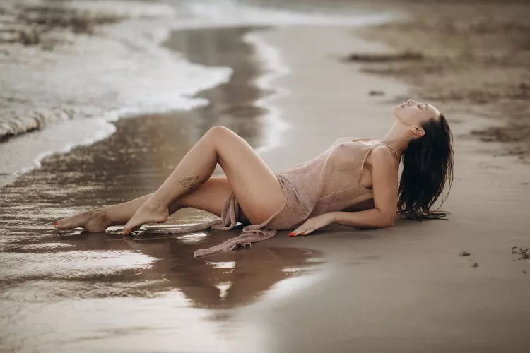 Only sheer tunic, daring on a public beach