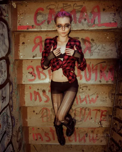 punk charm shines through in the dim stairwell