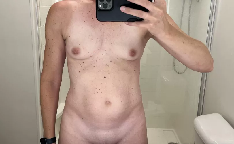 Hotel mirrors have good lighting! Tiny MILF tits in the mirror.