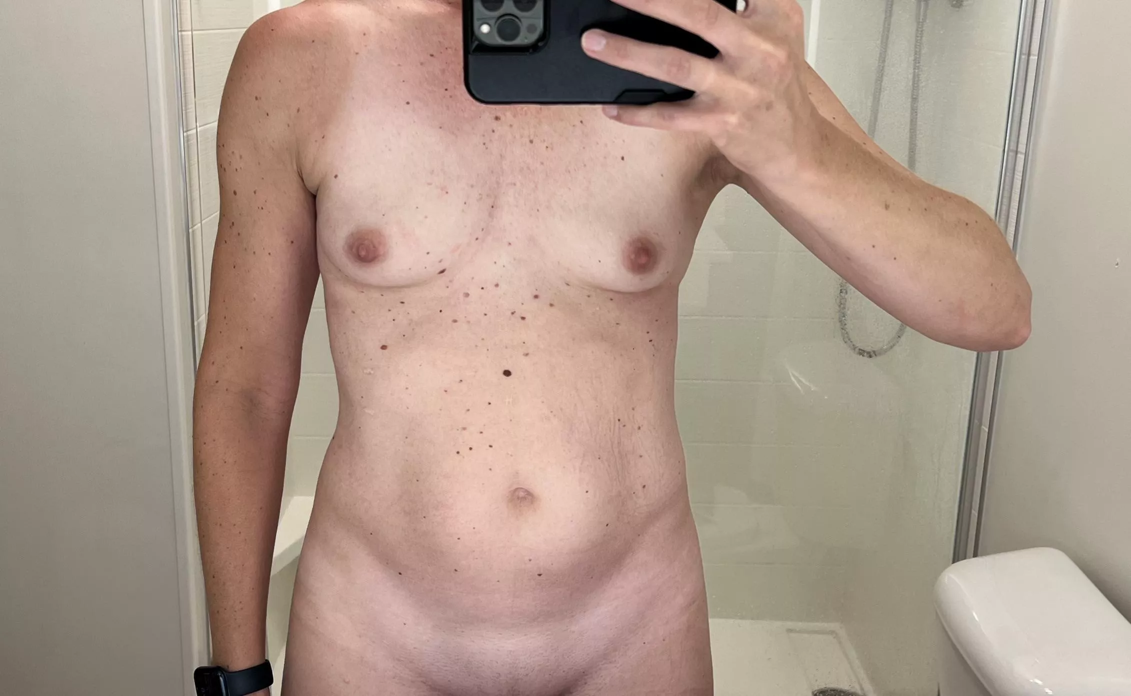 Hotel mirrors have good lighting! Tiny MILF tits in the mirror.
