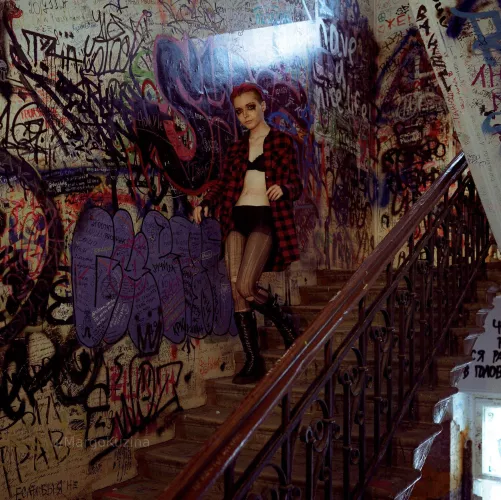 urban punk charm in a dirty stairwell