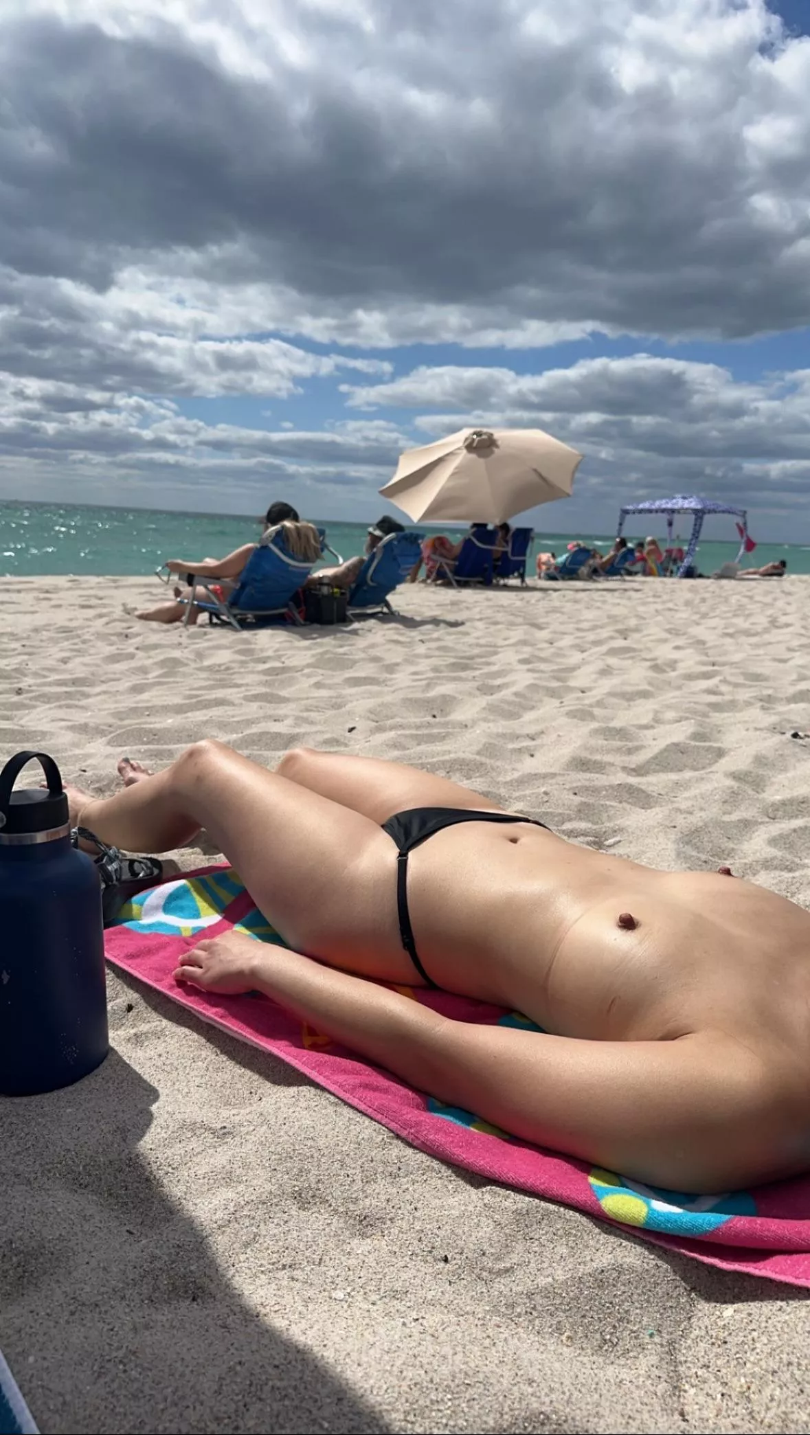 Tanning Topless at the Beach