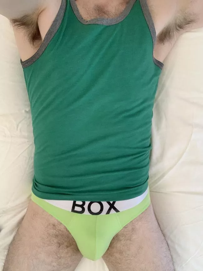 Showing in a tank & briefs