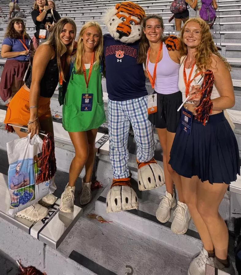 With the Mascot. Left to Right, 1-4.